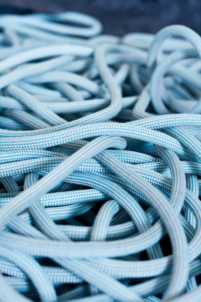 Mastering the First Impression: Your intriguing post title goes here Detailed view of blue climbing rope tangled on a surface, showcasing texture and patterns.